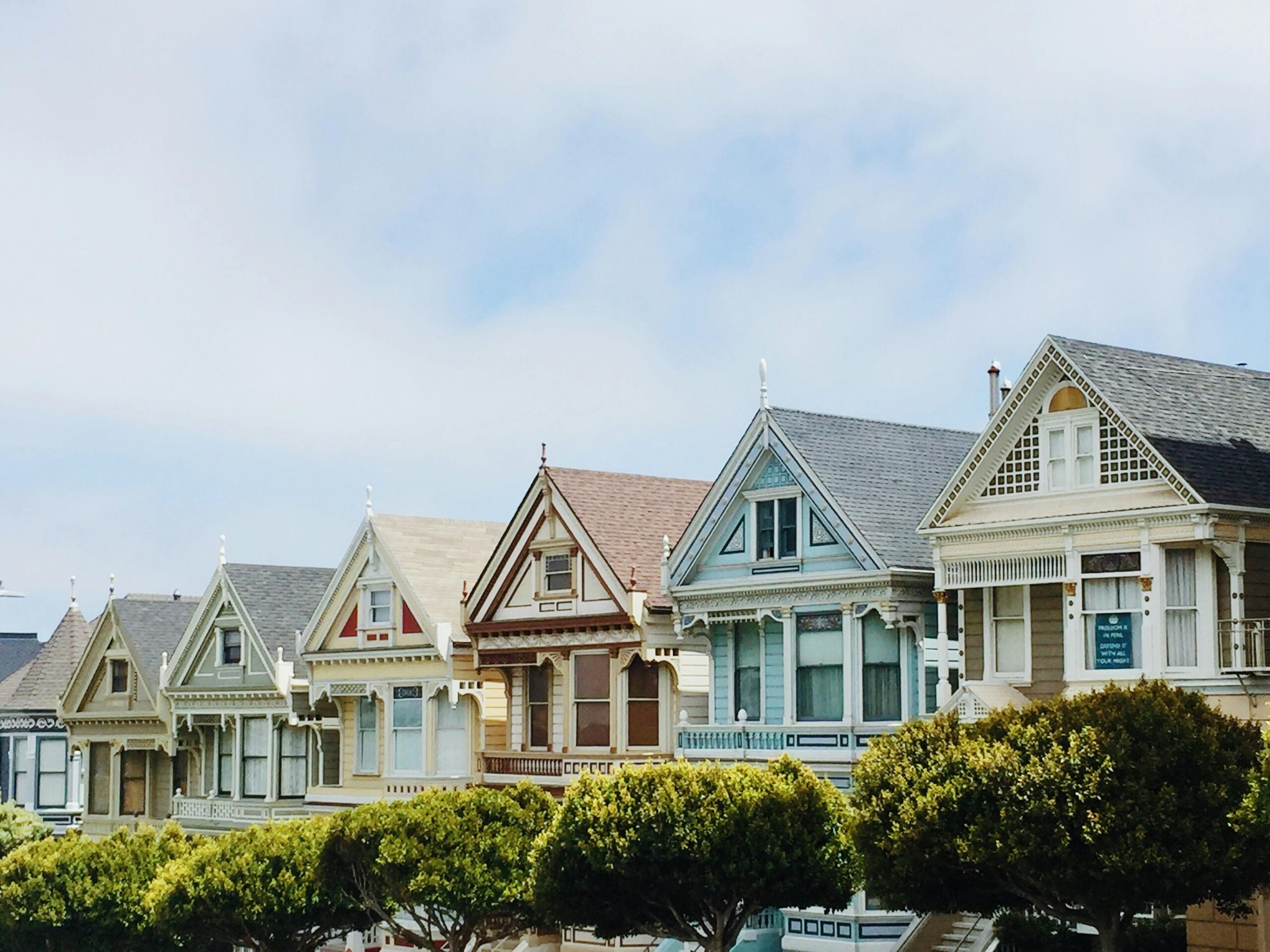 Debt Collection Solutions for Property Managers: Image of colorful houses symbolizing a residential property managed by a debt collection agency to recover unpaid rent.