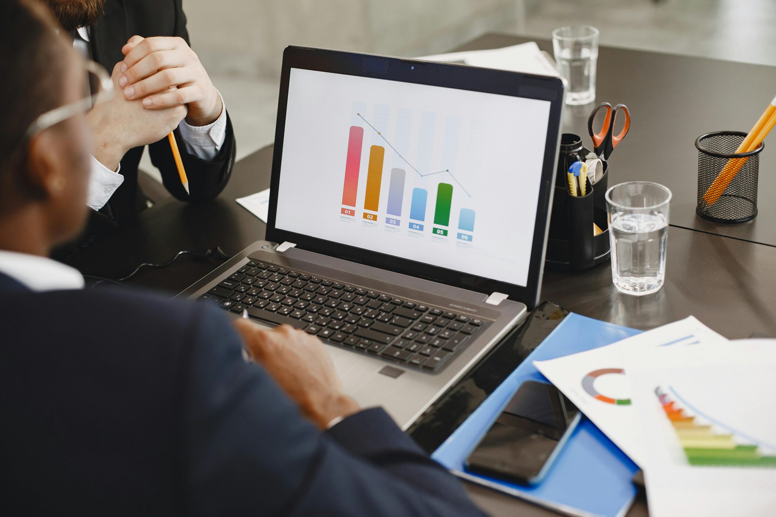 New entrepreneur reviewing financial documents for budgeting and forecasting.
