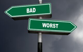 Street signs: "Bad" pointing left, "Worse" pointing right, representing the path from slow payer to bad debt.