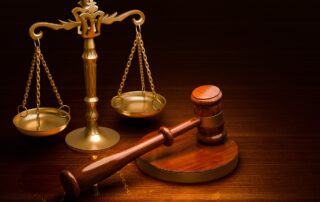 AI Debt Collection: A scale of justice and a gavel representing the importance of balancing innovation with ethical practices in AI-driven debt collection.
