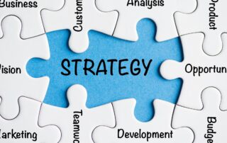 Debt Prevention for Businesses: A puzzle piece labeled "Strategy" connected to other business elements, symbolizing the importance of strategic planning in preventing debt for businesses.