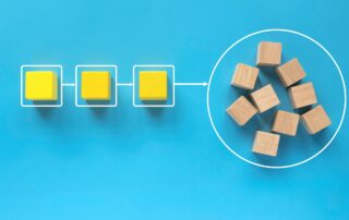 Beyond Phone Call: A circle of wooden blocks on a blue background, representing collaboration and a comprehensive approach to debt collection.
